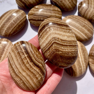 CHOCOLATE CALCITE PALM STONE Palmstone The Crystal Avenues