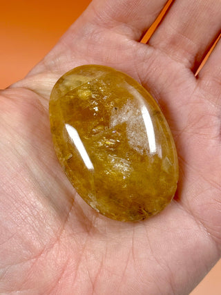 HONEY OPTICAL CALCITE PALM STONE (6) Palmstone The Crystal Avenues