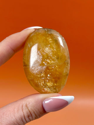 HONEY OPTICAL CALCITE PALM STONE (6) Palmstone The Crystal Avenues