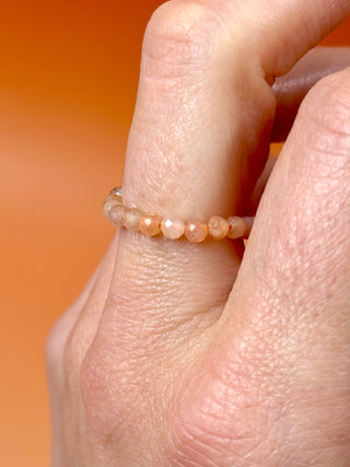 PEACH MOONSTONE - CRYSTAL STRETCH RING WITH FACETED BEADS Bracelet The Crystal Avenues