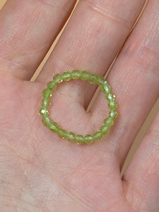 PERIDOT - CRYSTAL STRETCH RING WITH FACETED BEADS Bracelet The Crystal Avenues