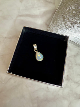 WHITE ETHIOPIAN OPAL SILVER PENDANT (NO. 4) The Crystal Avenues