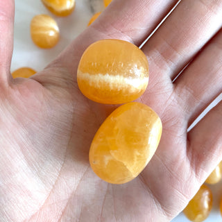 ORANGE CALCITE EXTRA QUALITY TUMBLE STONE tumble stone The Crystal Avenues