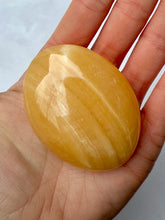 Indlæs billede til gallerivisning MANGO CALCITE PALM STONE (1) tumble stone The Crystal Avenues 
