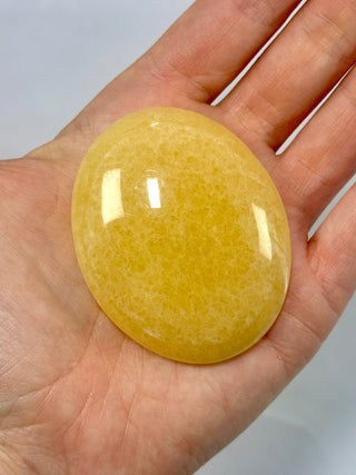 MANGO CALCITE PALM STONE (3) tumble stone The Crystal Avenues 
