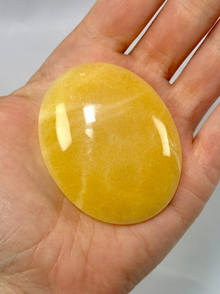 MANGO CALCITE PALM STONE (4) tumble stone The Crystal Avenues 