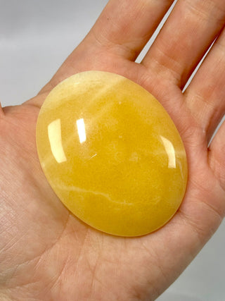 MANGO CALCITE PALM STONE (4) tumble stone The Crystal Avenues 
