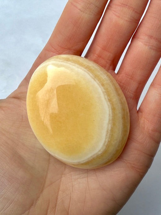 MANGO CALCITE PALM STONE (4) tumble stone The Crystal Avenues 