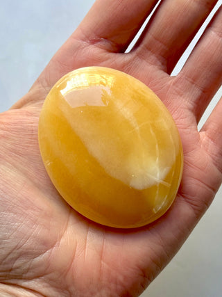 MANGO CALCITE PALM STONE (5) tumble stone The Crystal Avenues 