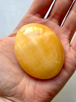 MANGO CALCITE PALM STONE (6) tumble stone The Crystal Avenues 