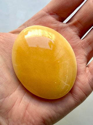 MANGO CALCITE PALM STONE (7) tumble stone The Crystal Avenues 
