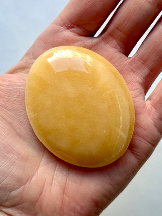 MANGO CALCITE PALM STONE (7) tumble stone The Crystal Avenues 