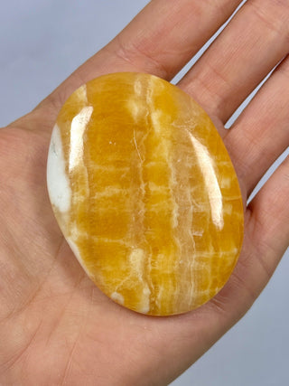 ORANGE CALCITE PALM STONE (1) tumble stone The Crystal Avenues 