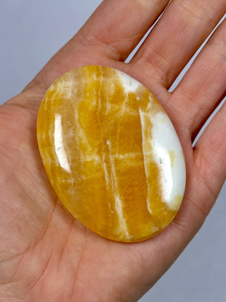 ORANGE CALCITE PALM STONE (3) tumble stone The Crystal Avenues 
