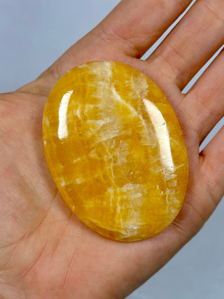 ORANGE CALCITE PALM STONE (4) tumble stone The Crystal Avenues 