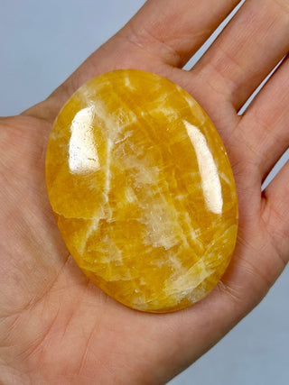 ORANGE CALCITE PALM STONE (4) tumble stone The Crystal Avenues 