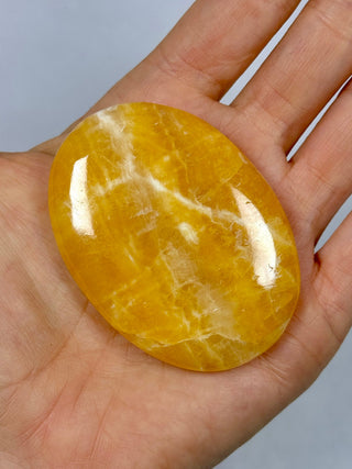ORANGE CALCITE PALM STONE (5) tumble stone The Crystal Avenues 